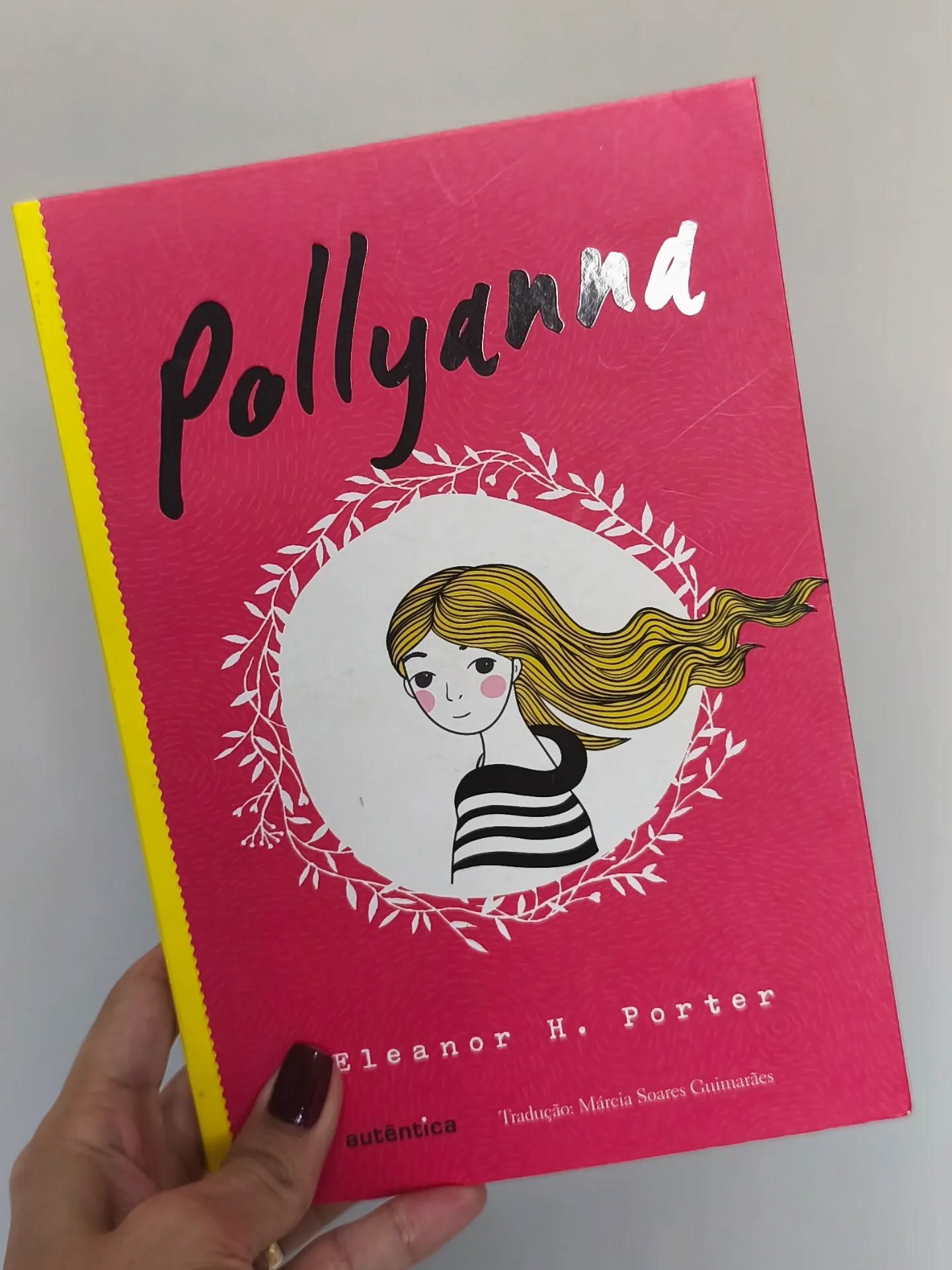Livro Pollyanna de Eleanor H. Porter, edição rosa da Autêntica